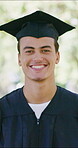 Graduation, face or man outdoor with smile, college pride or optimism in academic achievement. Education, happy or university student on campus with gown, confidence or success in farewell ceremony.