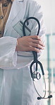 Confidence, hands and stethoscope with doctor in hospital for health or medical wellness. Arms crossed, consulting and woman healthcare professional in clinic for appointment, checkup or trust