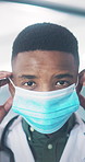 Face mask, doctor and black man in clinic, healthcare and medical procedure for compliance. African person, physician and professional in hospital, cover for protection and ppe for hygiene protocols