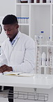 Documents, black man and scientist in laboratory with writing for medical research in science. Time lapse, notebook and African male biologist with notes for pharmaceutical development with study.
