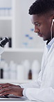 Laptop, black man and scientist in laboratory with earphones for music with medical research. Computer, audio tech and African male biologist with online report on pharmaceutical study with playlist.