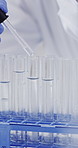 Hands, scientist and dropper with sample at laboratory, medical research and ppe gloves for virus cure. Person, test tube and equipment with pharmaceutical innovation, safety or vaccine development