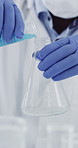 Hands, scientist and vial with test tube at laboratory, medical research and ppe gloves for virus sample. Person, tools and equipment with pharmaceutical innovation, liquid or vaccine development