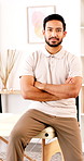 Arms crossed, face and occupational therapist in office for healthcare or rehabilitation. Confidence, serious and therapy with chiropractor man in medical clinic for recovery, service or wellness