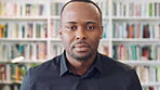 Creative, face and man with pride in library, knowledge or serious for publishing career development. Confident, literary agent and black person with ambition and talent representation job in Nigeria