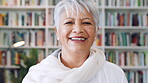 Creative, face and woman with smile in library, education or pride for publishing career development. Bookstore, author and mature person with knowledge, laughing and confident with literacy job