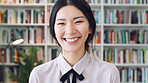 Confident, face and businesswoman with smile in library, knowledge or paralegal with job opportunity. Corporate, law assistant and Asian person with career growth, legal books and research for case
