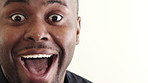 Face, surprise and black man with laugh for funny joke, positive attitude and optimistic in closeup. Space, happy African person and shock for comedy humor, good mood or wow reaction for announcement
