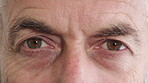 Blink, eyes and vision with mature man closeup for optometry appointment or checkup. Healthcare, optical and eyesight with person at ophthalmology assessment for visual correction or improvement