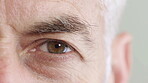 Blink, eye and perception with man in studio for optometry appointment or checkup. Eyesight, healthcare and vision with mature patient at ophthalmology assessment for visual correction or improvement