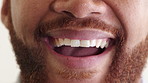 Face, teeth and man laugh with dental health, oral wellness or smile for orthodontics in studio. Self care, funny person and clean mouth for gum hygiene, veneers and dentistry with fresh breath