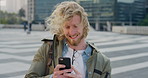 City, phone and windy with student man outdoor for morning commute to college campus. App, class schedule and smile of university scholar in urban town to search information on mobile for travel