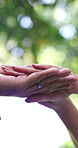Hands, love and engagement ring with couple, low angle and bonding together with commitment. Diamond, jewelry and anniversary celebration with people, romance and relationship with care and below