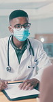 Mask, doctor and patient with writing in clinic, health consultation and medical history discussion. Appointment, people and gp with ppe for wellness evaluation, symptoms info and explain treatment