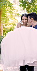 Carrying, bride and happy couple in park on wedding day, laughing and bonding with partner in event. Outdoor, romance and people with marriage commitment, love and celebration with groom in garden
