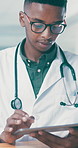 Glasses, healthcare and tablet with doctor black man in hospital for agenda, schedule or search. App, review and smile of happy medical professional at desk in clinic for digital or online calendar
