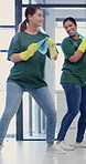 Cleaning, team or women with dancing in office, janitorial service or laugh for hygiene maintenance. Glass, cleaner or happy people with supplies for sanitation of workplace, singing or housekeeping