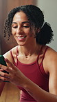 Fitness, woman and laugh in home with phone, funny notification and viral yoga trend on internet. Girl, break and mobile in living room for social media, typing comment and thinking of pilates joke