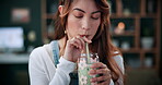 Matcha, glass and smile with woman in home for wellness, nutrition or antioxidant diet. Health, green tea latte and satisfaction with person and drink in living room of apartment for vitamin smoothie