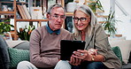 Happy, discussion and old couple in home with tablet, reading news or bonding together for retirement. Senior, married people and talk in living room with tech, online article or social media update.
