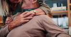 Love, retirement and old couple in home with hug, security or romantic moment in marriage. Happy, comfort and elderly people on sofa with embrace, commitment or connection in healthy relationship.