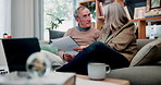 Senior, couple and discussion in home with document, retirement planning and review asset management. Elderly, married people and talk on couch with paperwork, estate policy and check pension fund.