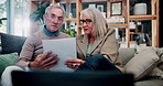 Senior, couple and discussion in house with document, retirement planning and review asset management. Elderly, married people and talk on couch with paperwork, estate policy and check pension fund.