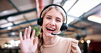 Woman, face and consultant with headset or wave in office for video call or virtual assistance. Portrait, female person or friendly agent with smile, hello or mic in POV for online advice or chat