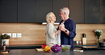 Cooking, fun or old couple in kitchen with dancing, playful moment or bonding in meal prep. Smile, groove or senior people in house with love, culinary activity or romantic connection in retirement.
