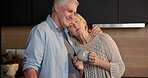 Coffee, hug and senior couple in home of kitchen together for bonding, morning or security. Drink, relationship and retirement with happy old people in apartment for connection, peace or relax