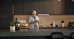 Thinking, phone and senior man in kitchen for texting, reading message and social media notification. Home, web chat or old person with mobile for internet search, retirement blog reflection or smile