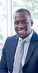 Face, business and black man in waiting room with smile, recruitment and job interview for vacancy. Portrait, male person and candidate in office for hiring, human resources process and onboarding