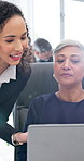 Team, planning and business women with laptop, accounting budget and coaching in office. Manager, computer and talk with auditor for financial records, tax advice and help with training feedback