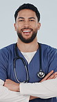 Crossed arms, man and face of nurse in studio with confidence for career in medical service. Smile, professional and portrait of male healthcare worker with pride for about us on white background.