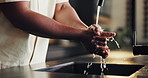 Man, kitchen and washing hands with water in basin for hygiene, disinfection or protection. Male person, rinse and cleaning dirt with tap in sink for cleanliness, bacteria or germ removal in home
