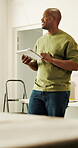 Architecture, thinking or black man in home with tablet, renovation or brainstorming on layout upgrade. Happy, reflection or interior designer with tech, restoration insight or improvement in remodel