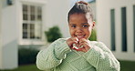 Happy, outdoor and face of child with heart hands by new home with positive attitude for moving safety. Smile, development and portrait of girl kid with love gesture in backyard for growth by house.