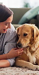 Love, woman and relax with dog on carpet for domestic companion, bonding and furry best friend. Affection, golden retriever and happy owner in home for pet care, canine connection and animal adoption