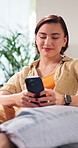 Typing, phone and woman on sofa for social media, online chatting and message with dog on weekend. Home, happy and person on mobile app for connection, networking or notification to relax with pet