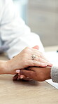 Healthcare, doctor and holding hands with patient in hospital, kindness and comfort after diagnosis. Clinic, consultation and medical professional with empathy for person, wellness or healing support
