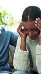Console, empathy and woman with stress on sofa in home living room for anxiety or grief. Frustration, headache or sadness with person comforting friend in apartment for care, love and support
