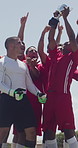 Outdoor, team and men with trophy for celebration, soccer tournament and match success for smile. Yelling, excited  and football players with kiss for victory cup, competition winner and achievement