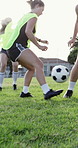 Soccer, ball and women on field for fitness, training and practice match for tournament. Below, athlete and people outdoor with dribbling skills, football performance and sports games for competition