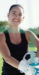 Face, woman and goalkeeper on field with soccer ball, gloves and practice for sports performance. Happy, person and football player outdoor with equipment, fitness and athlete training for wellness.