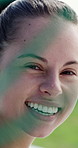 Face, soccer and happy woman by net, goalkeeper and confidence for game defense at pitch. Laugh, football player and portrait of person outdoor, professional goalie and sports athlete in France