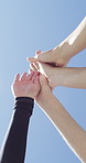 Fitness, friends and high five with hands for support, collaboration or solidarity outdoor with blue sky. Team, people and community together for motivation, exercise goal and low angle for synergy