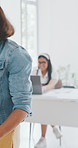 Headphones, woman and walk with greeting in office for arrival, respect and start marketing job. Polite, media buyer and open laptop at agency for reporting to duty, campaign management and coworking
