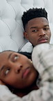 Angry, man and couple in bed with conflict, argument and tension from disagreement. Upset, black people and ignoring partner at house for silent treatment, emotional distance and sleepless with drama