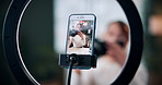 Woman, photographer and vlogger with phone screen for live recording or online tutorial in home. Female person, freelancer or content creator with smartphone or ring light  for advice, help or tips