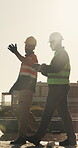 Construction, walk or team on site with inspection, progress track or evaluation in feedback chat. Flare, men or engineers with ppe, quality control or partner assessment in industrial development.